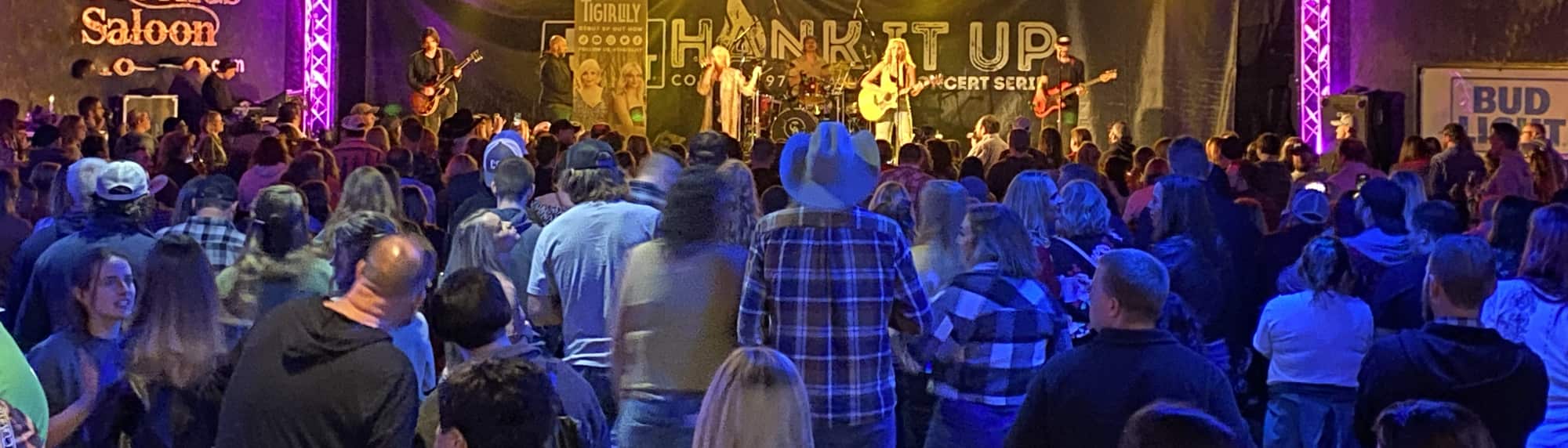 country concert with fans wearing cowboy hats Orlando